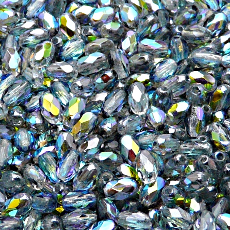 50ks České skleněné broušené tvarové ohňovky olivy 6x4mm čirá/ modrá duha